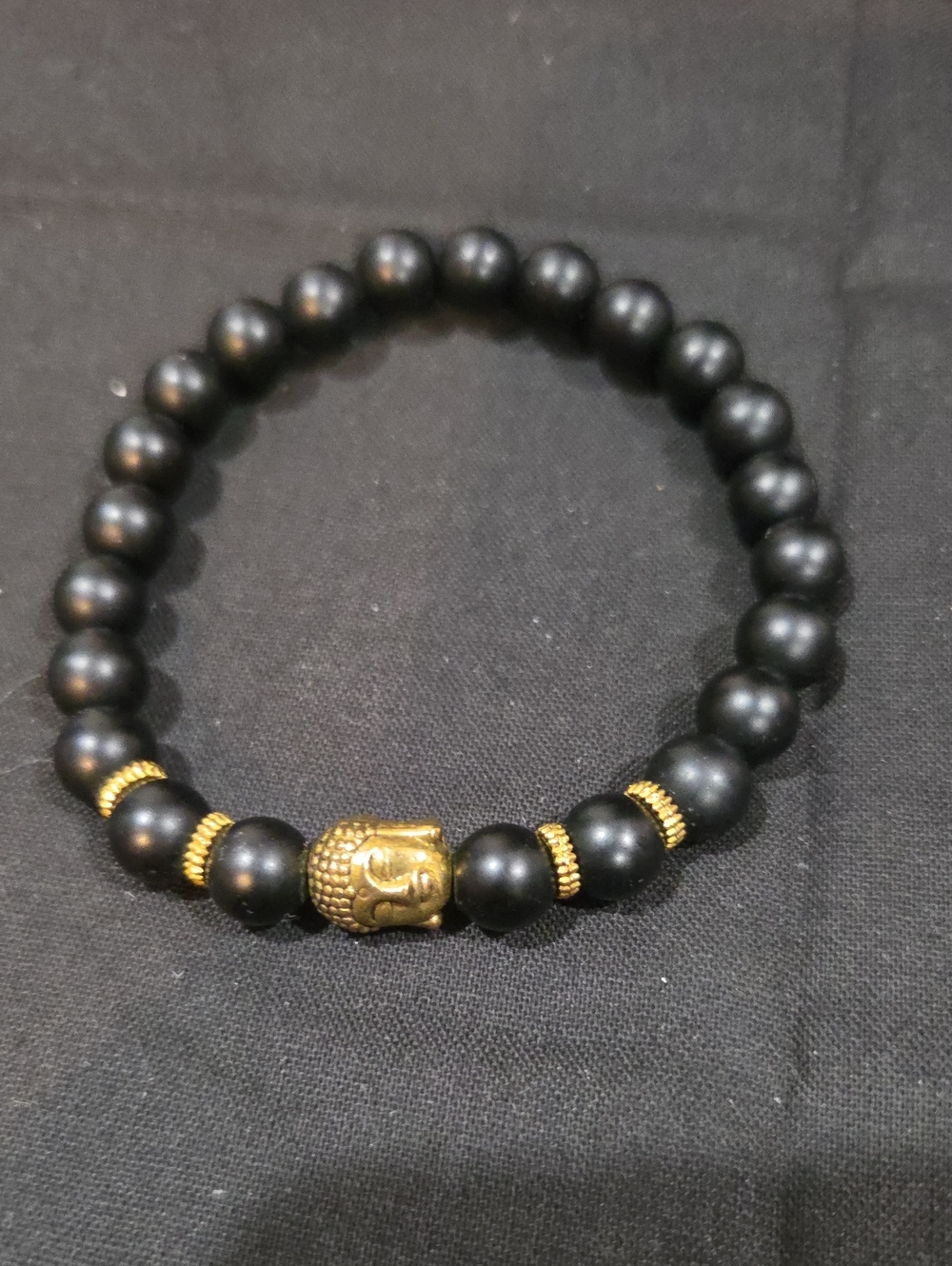 BLACK STONE WITH GOLDTONE BUDDHA BEAD BRACELET